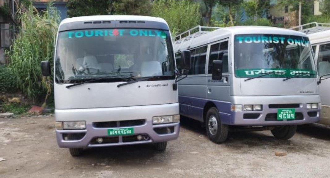 Two tourist buses parked side by side, illustrating transportation options for the Nepal Tour Package. 