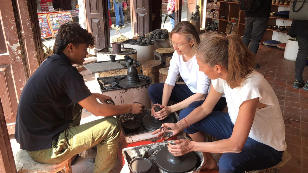 women learning from local