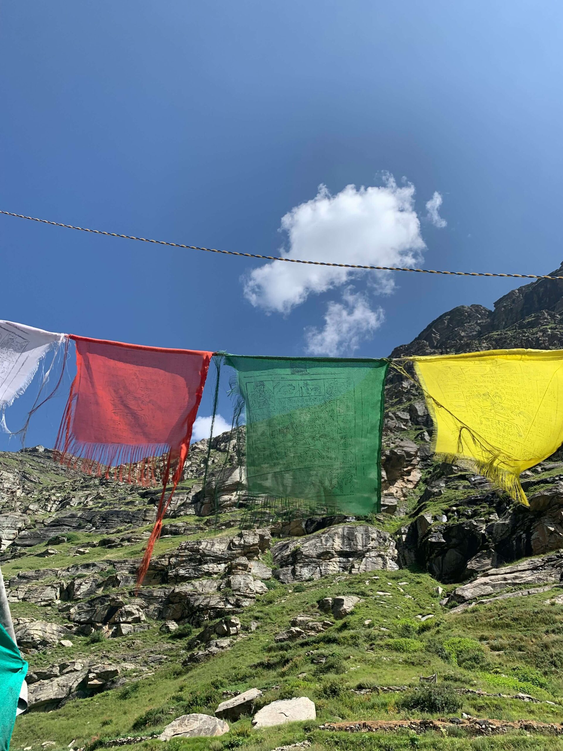 Colorful Tibetan prayer flags along the Manaslu Circuit Trek trail